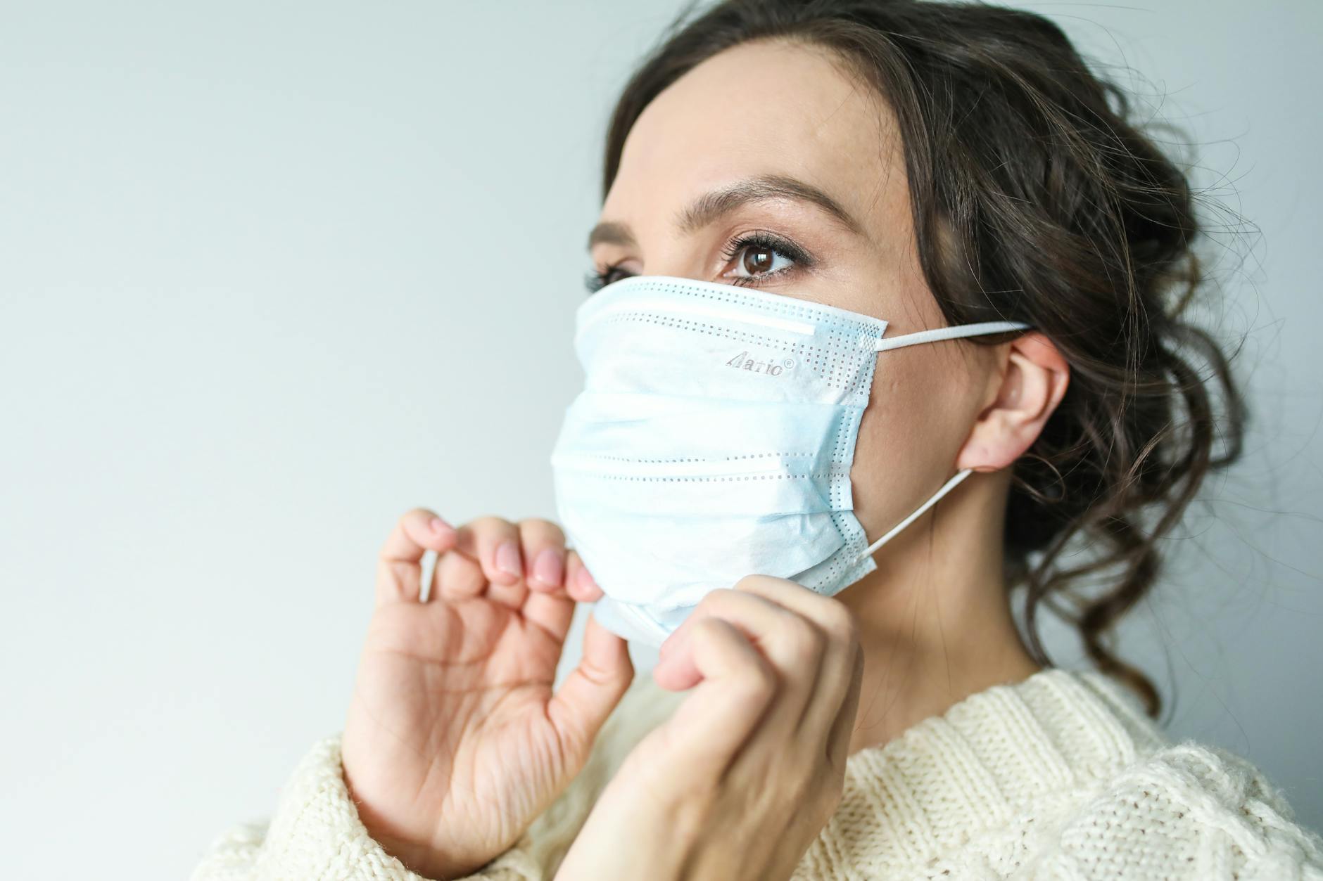 woman in white face mask