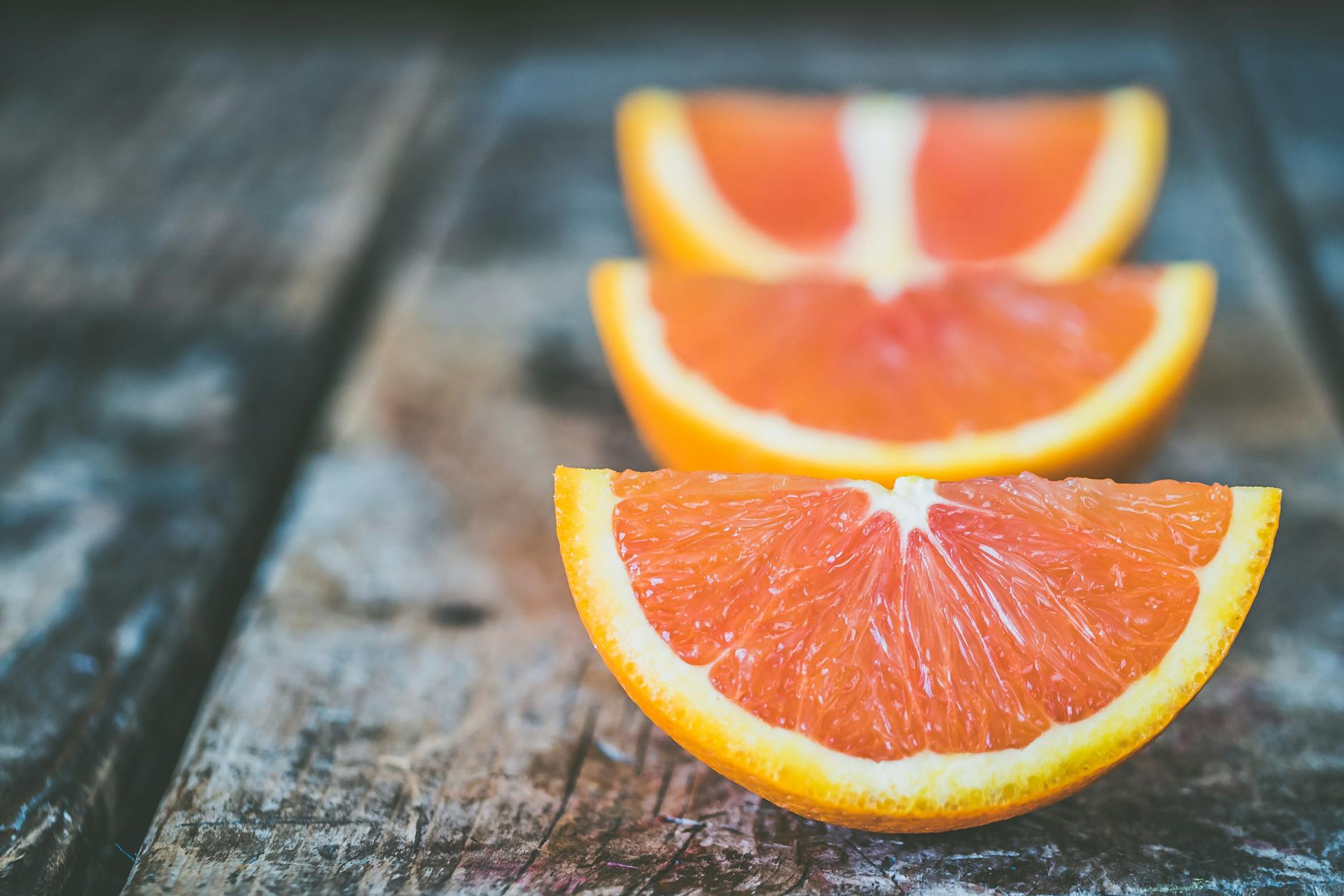 three sliced orange fruits