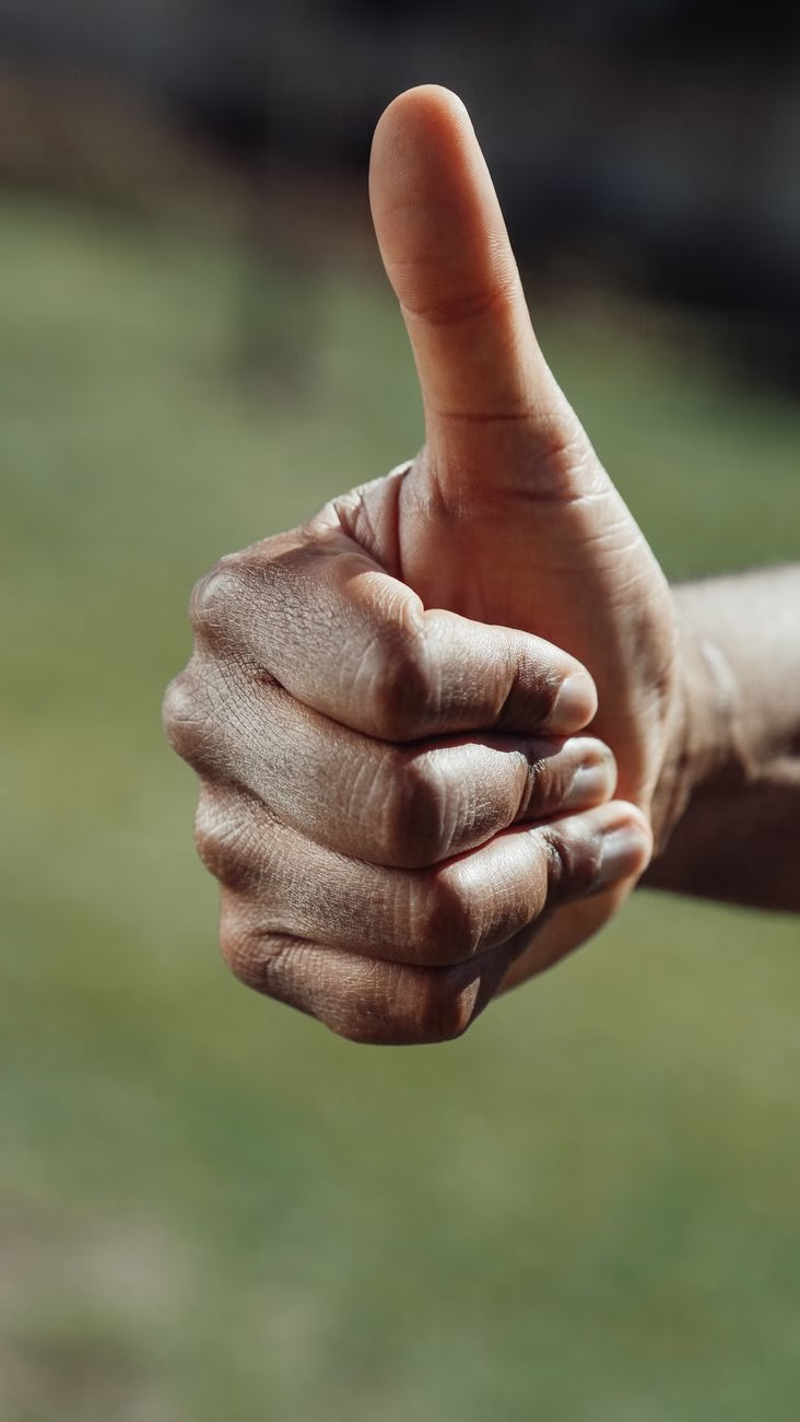 close up shot of a thumbs up